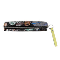 Pencil case with abstract pattern and yellow keychain on a white background