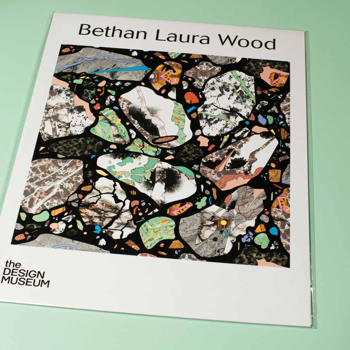 Poster with colorful abstract design and 'Bethan Laura Wood' text on a light green background