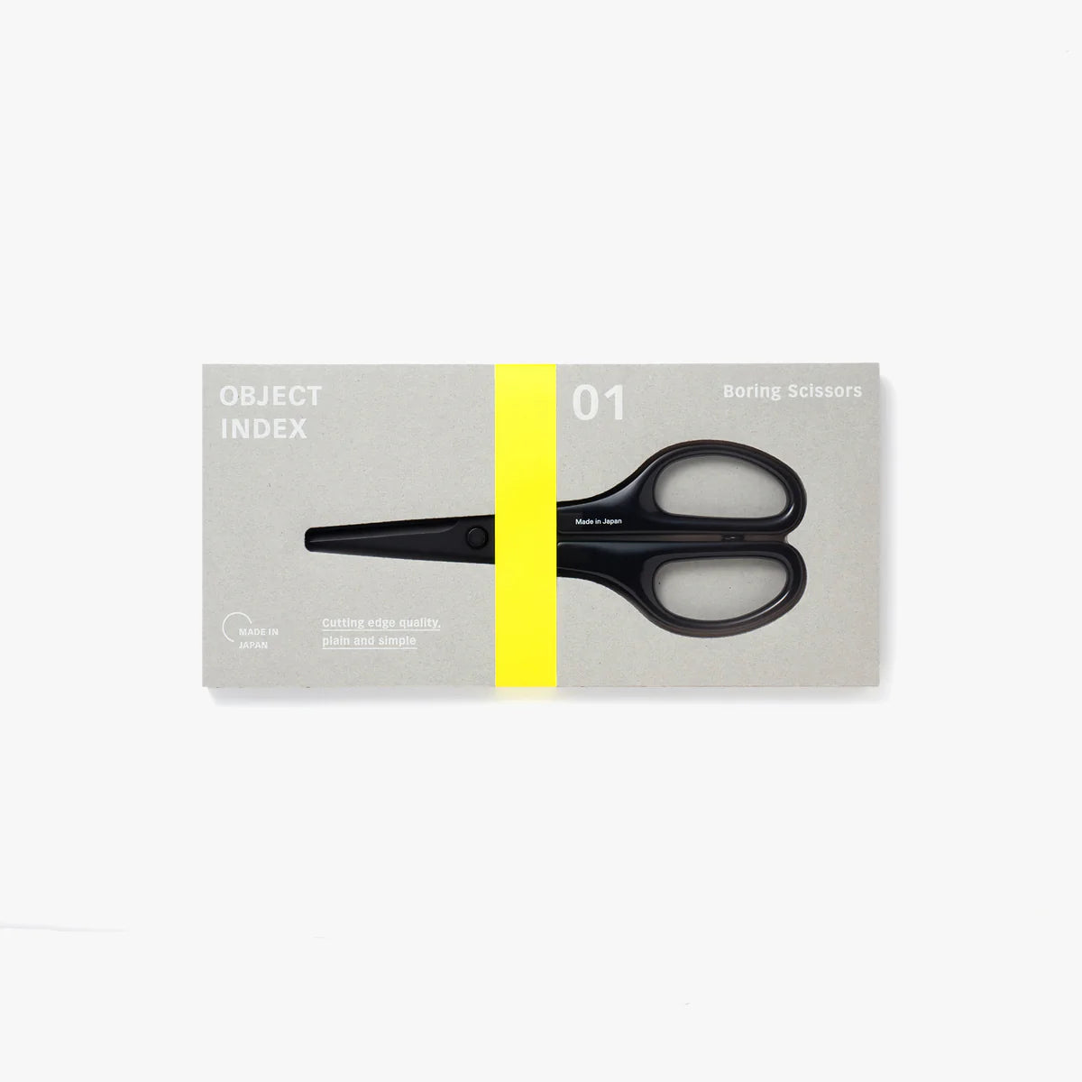 A pair of black scissors in a grey rectangular packaging box with neon yellow accents.