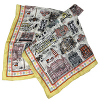 colourful patterned scarf with cityscape design on a white background