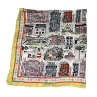 Colourful scarf with cityscape design featuring buildings, on a white background