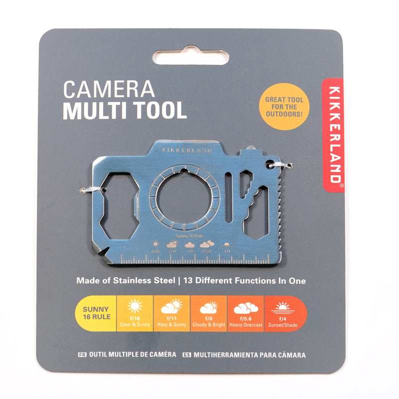 A silver steel camera-shaped multi tool with grey packaging.
