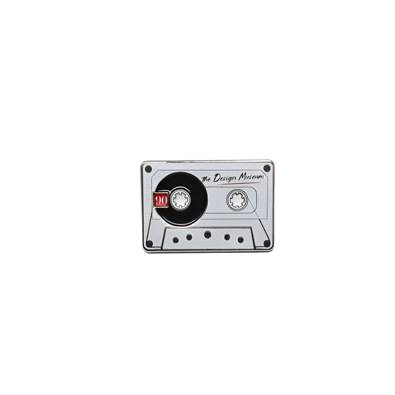 Cassette tape pin badge on a white background