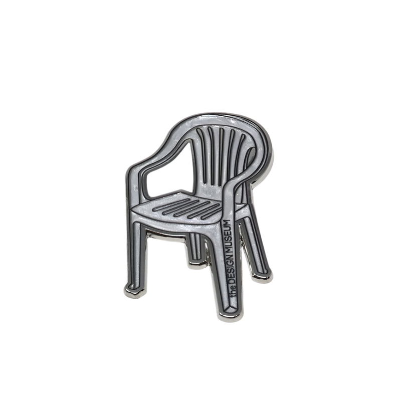 Metallic garden chair-shaped magnet on a white background