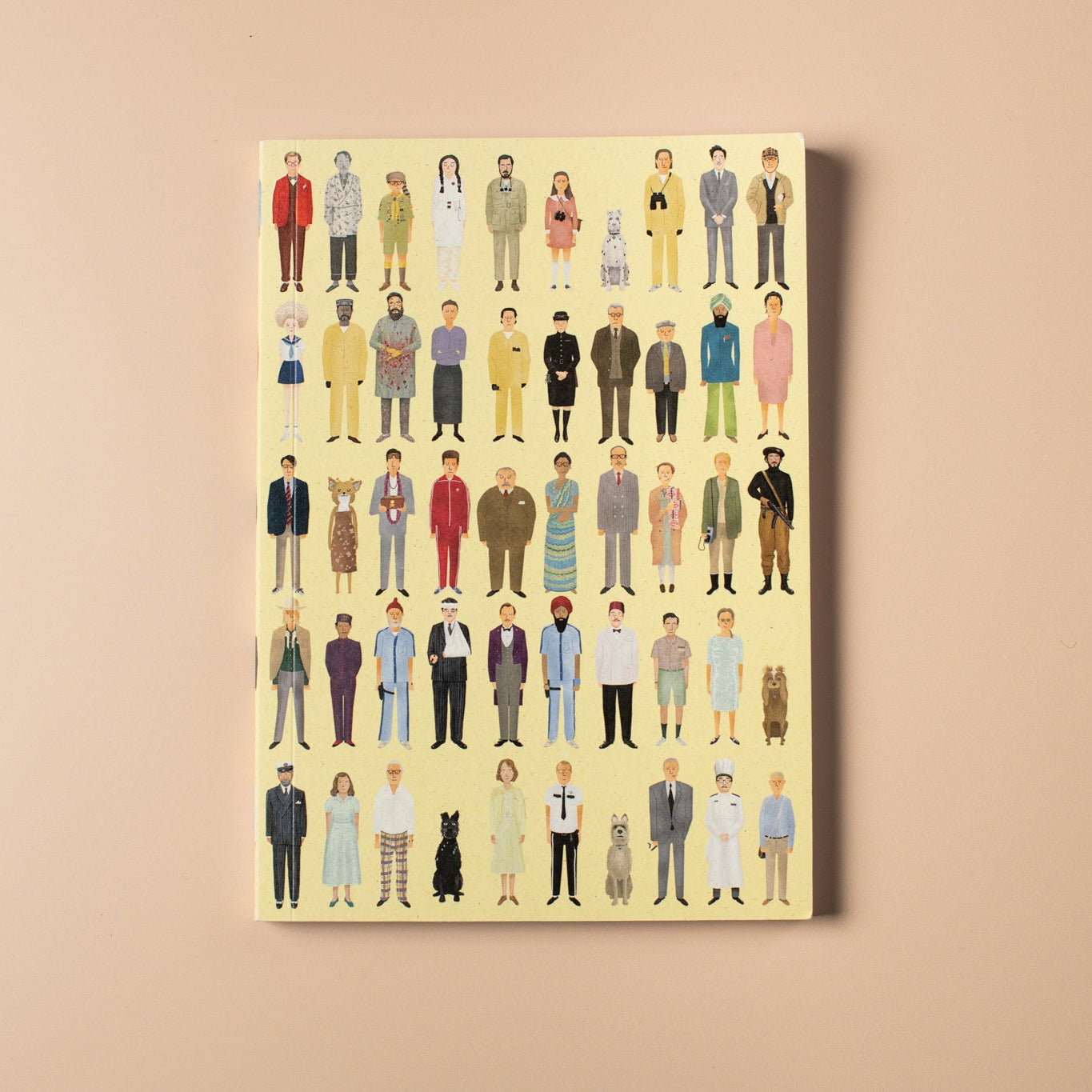 Yellow notebook with illustrations of people on a beige background