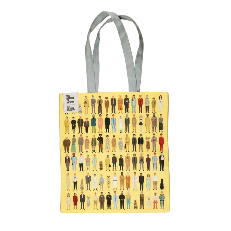 Yellow tote bag with illustrations of people and blue handles on a white background.