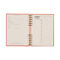 Open planner with pages showing a checklist and bullet template on a white background