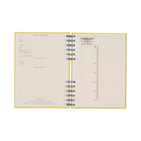 Open yellow notebook with blue spiral binding on a white background