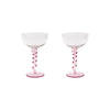 Two pink glass goblets on a white background