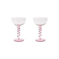 Two pink glass goblets on a white background
