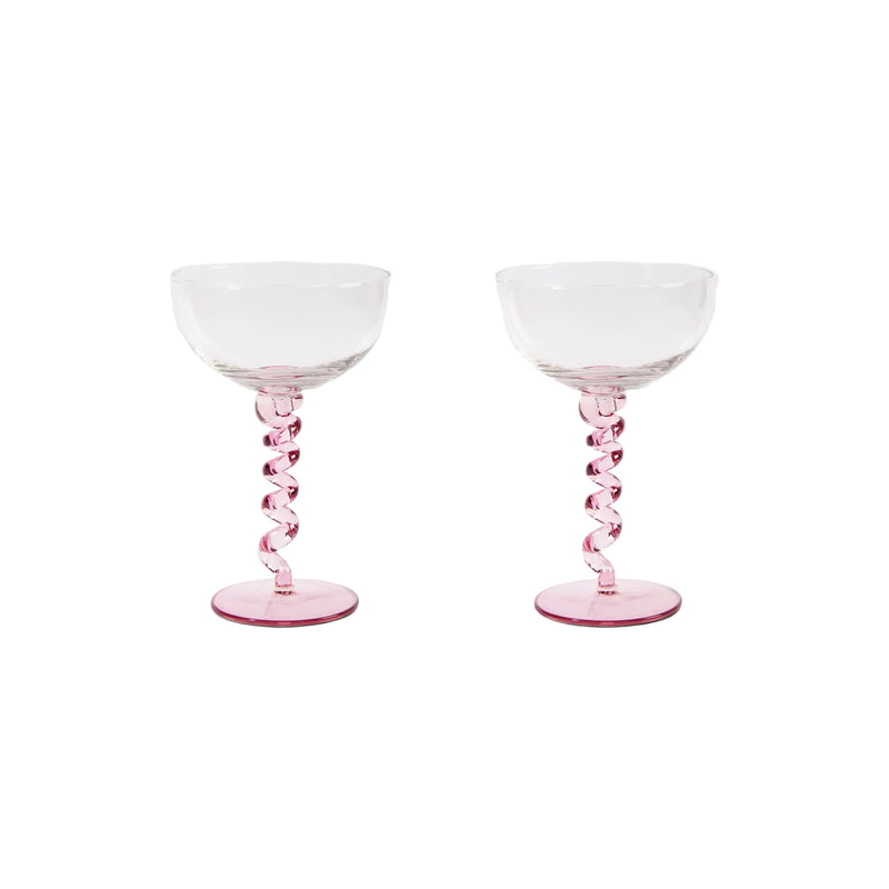 Two pink glass goblets on a white background