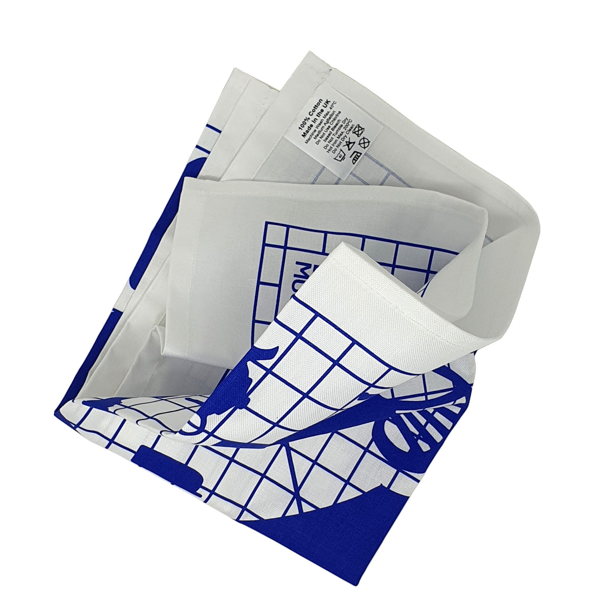 A folded white tea towel with blue designs of everyday objects on a blue grid. 