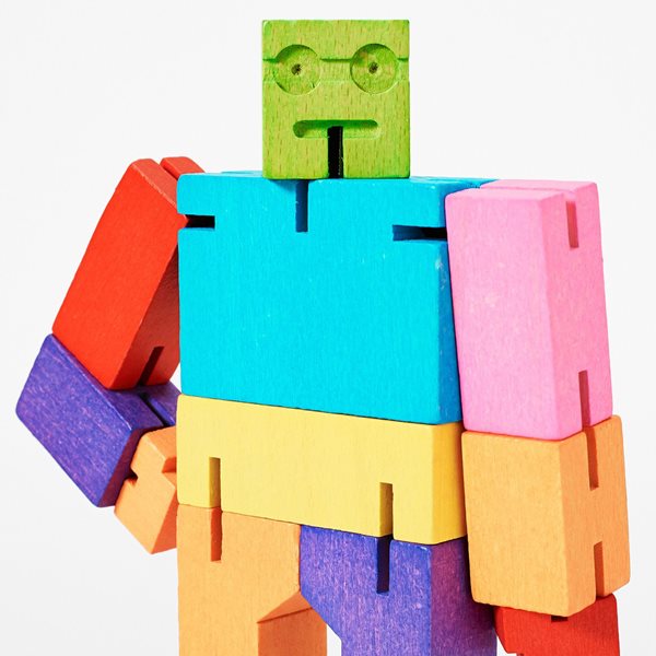 Close up of a colourful wooden toy robot.