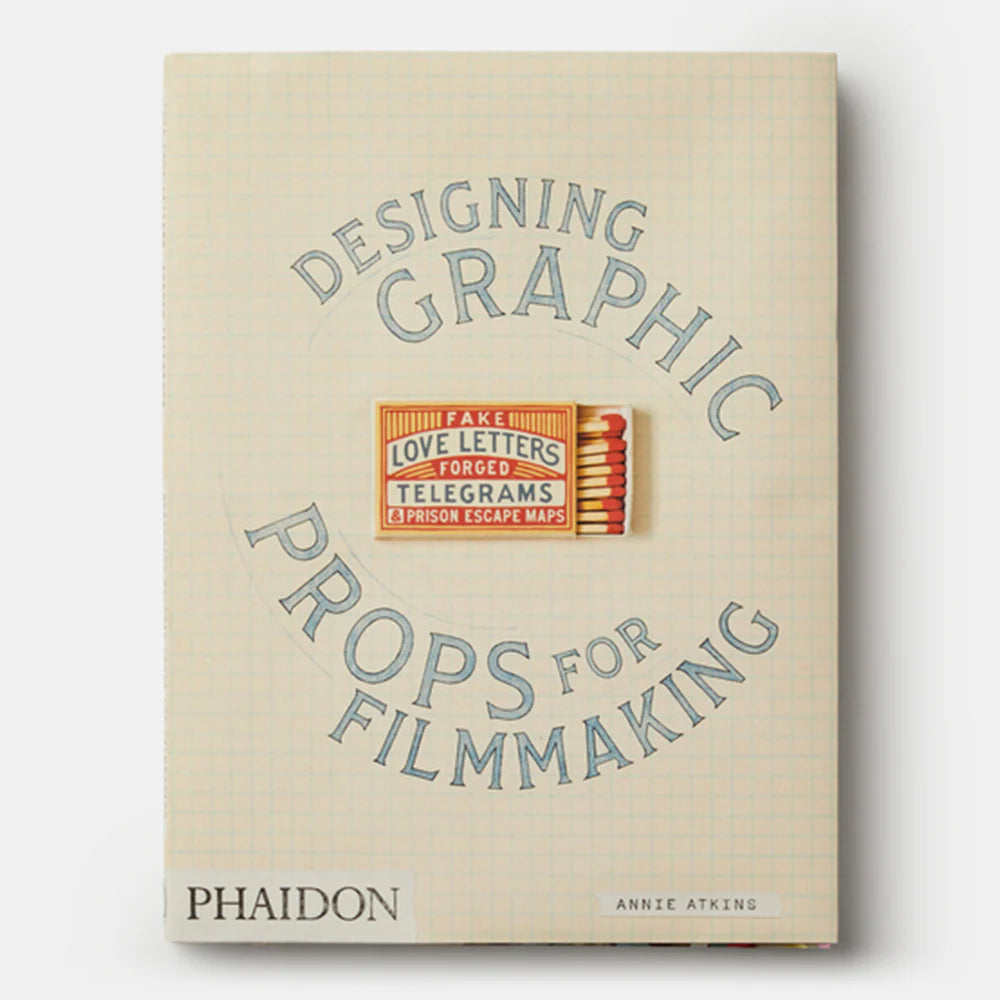 Book cover of 'Designing Graphic Props for Filmmaking' with blue text on a beige background