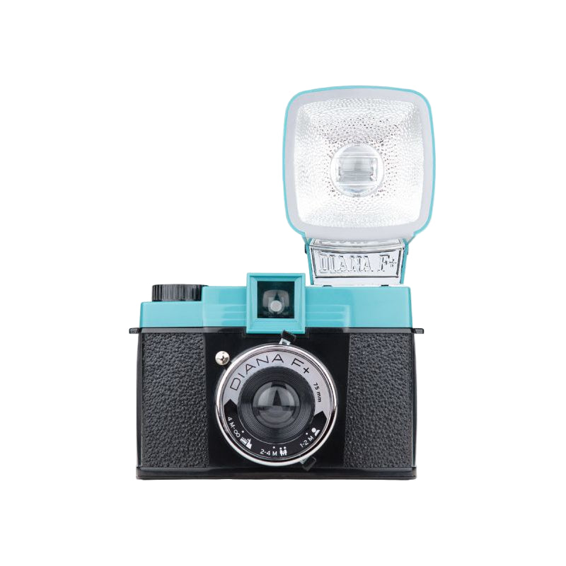 Vintage-style camera with a flash attachment on a white background