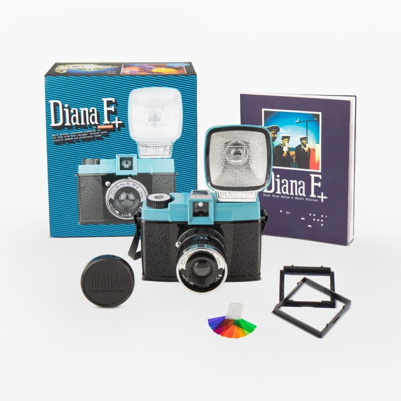 Lomography Diana F+ camera with accessories and packaging on a white background