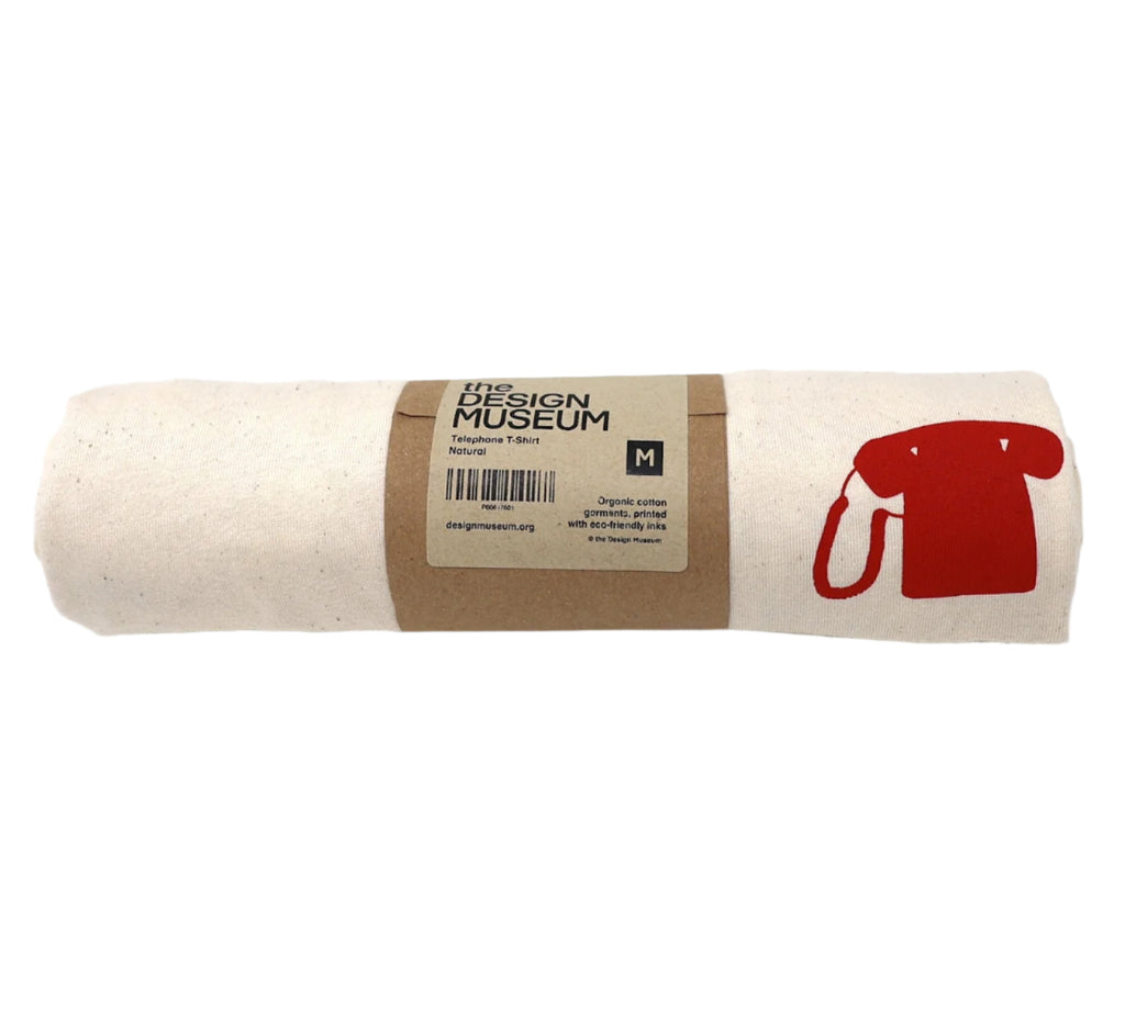 Ecru adult's short sleeved t-shirt featuring a small minimalistic monochrome image of a Cradle phone on its front top left side, printed in red. in this picture item is rolled into its original paper packaging as it is sold in the shops.