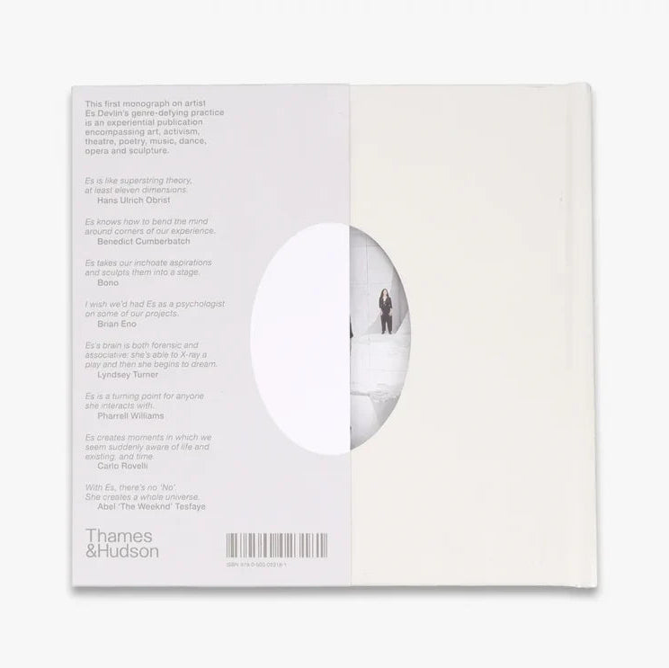 The back cover of a white book, featuring a white background with printed text, a barcode, and a circular cutout showing a minimalist scene of a person standing in a snowy landscape.