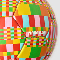 Colourful checkered football with 'Yinka Ilori' branding on a white background