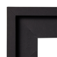 Close-up of a black picture frame corner with 'pop-up' brand logo.
