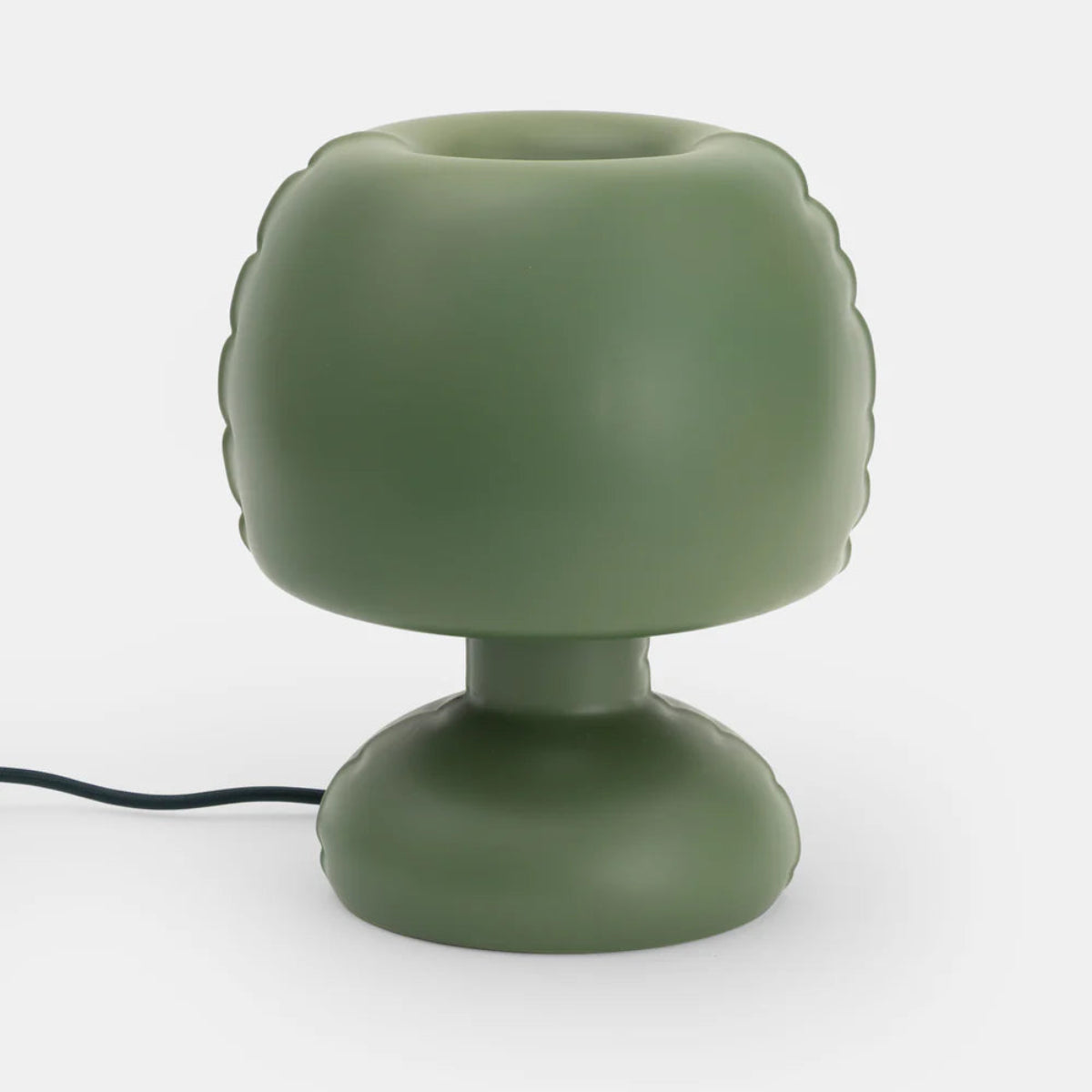 A dark green minimal shaped lamp on a white background.