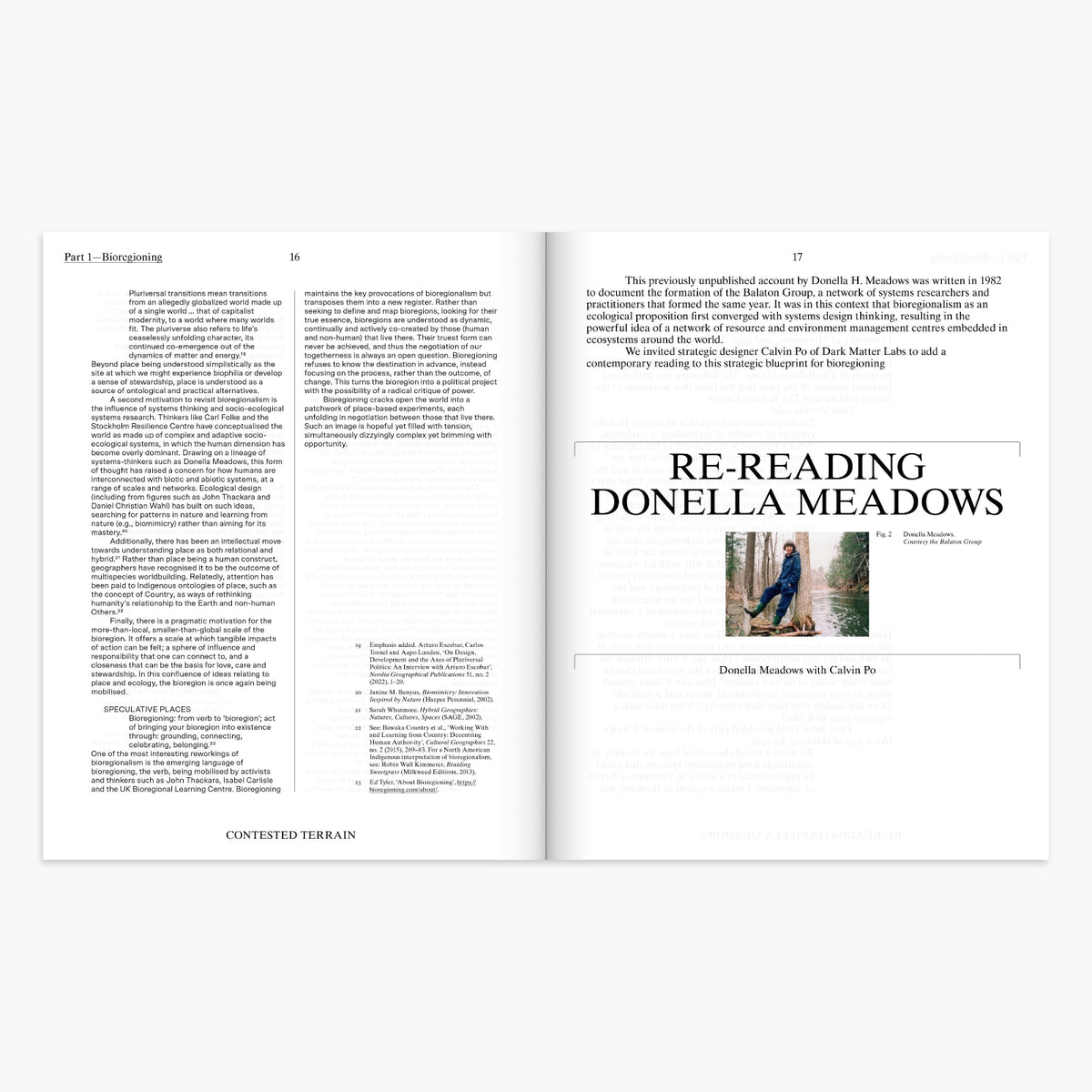 An open book spread showing printed pages with text and a small inset photo titled 'RE-READING DONELLA MEADOWS' on the right page, photographed against a light gray background.