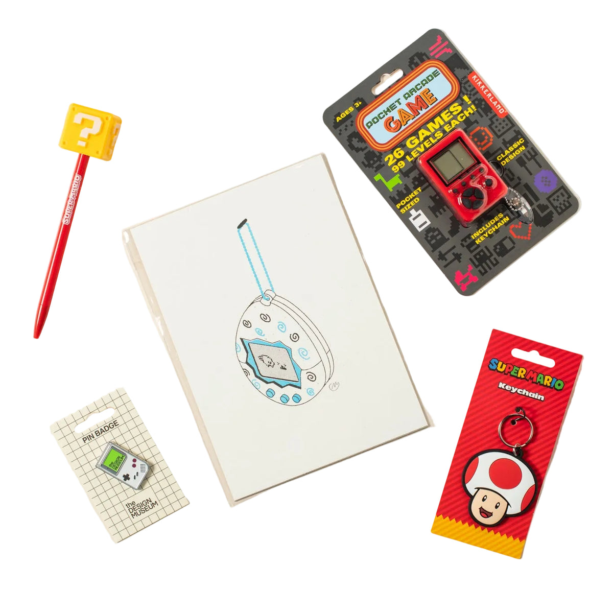 A flat-lay collection of gaming-themed stationery and accessories on a light beige background