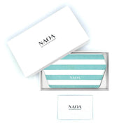 A blue and white stripped glasses case by NAOA, presented in a white box next to its white branded outer packaging and a small white card on a white background.