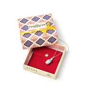 Silver grenade necklace in a jewelry box with a decorative blue and pink box on a white background
