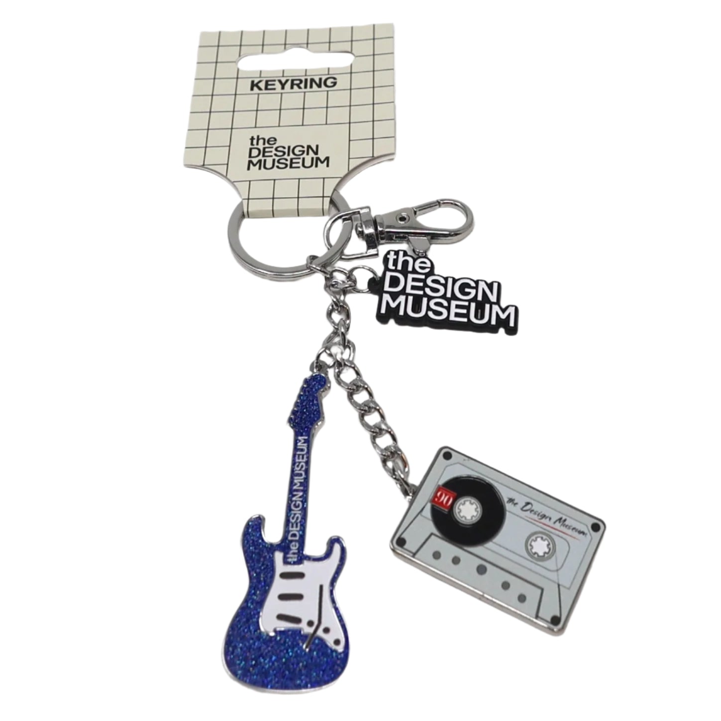 Keychain with guitar and cassette charm on a white background, featuring 'The Design Museum' branding.