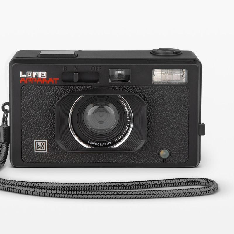 Black Lomo camera with a strap on a white background