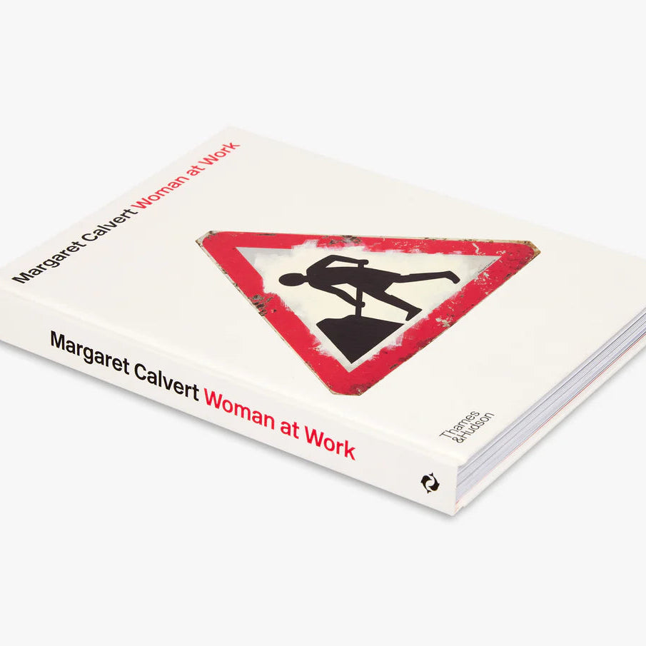 Book titled 'Woman at Work' by Margaret Calvert with a warning sign design on the cover.