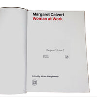 Open page of 'Margaret Calvert Woman at Work' featuring the artists' signature on a white background