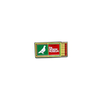 green and yellow matchbox pin badge with 'The Design Museum' logo on a white background