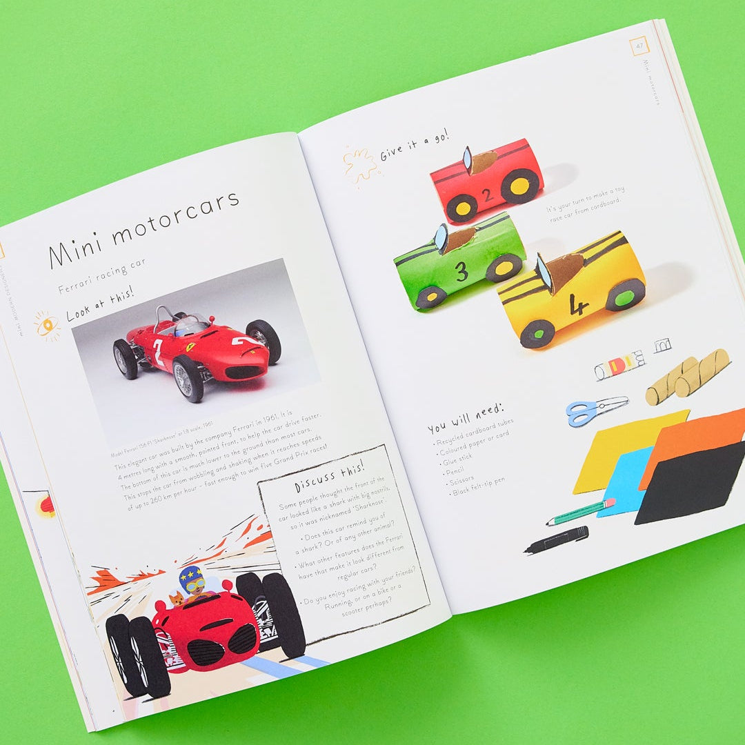 Open book with illustrations of mini motorcars on a green background