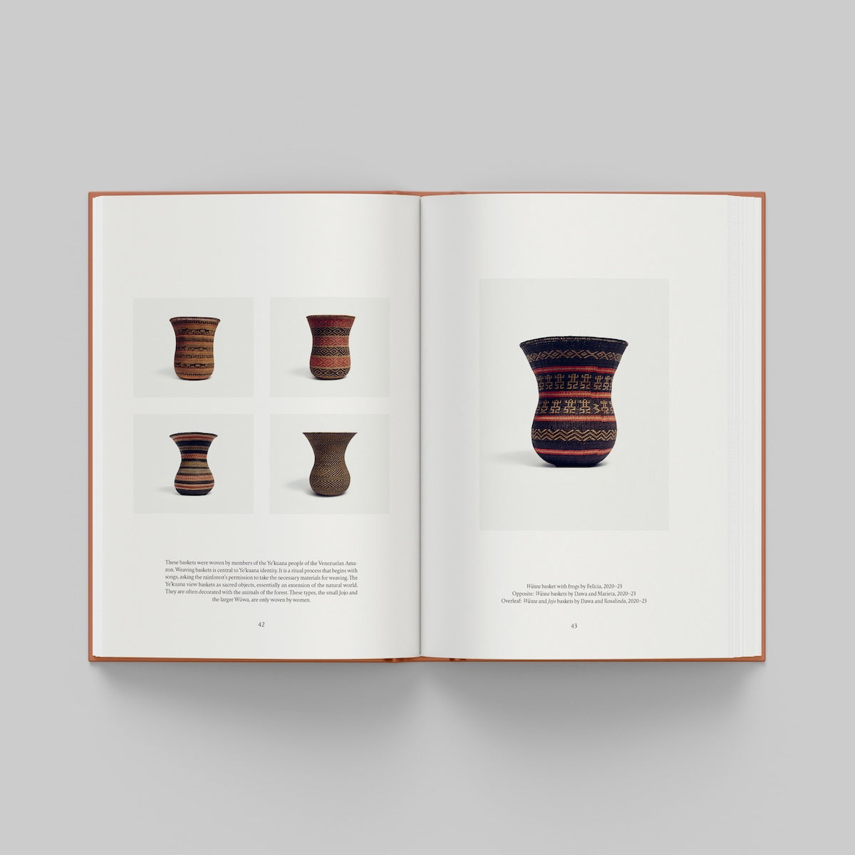 Open page of More Than Human catalogue featuring images of ceramic vases on a gray background