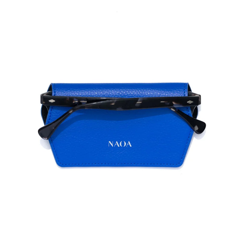 Blue glasses case with black glasses inside on a white background