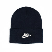 Black beanie with a white logo on a white background