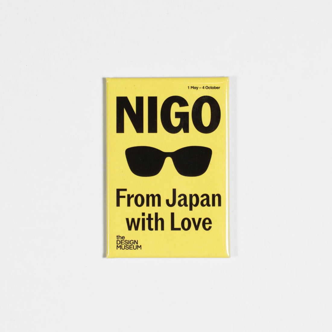 Yellow magnet with 'NIGO' and 'From Japan with Love' text on a white background