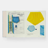 Open page of Nike Apparel book featuring photos and sketches of blue and yellow Nike shorts.
