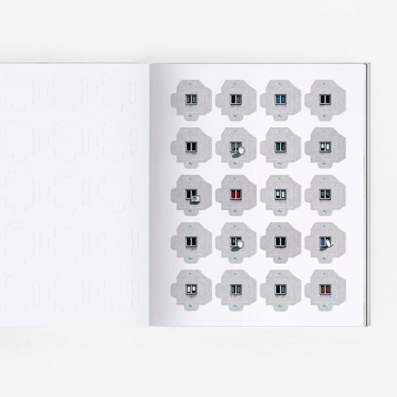 Open page of Panelki model featuring cut out pieces of brutalist building blocks.