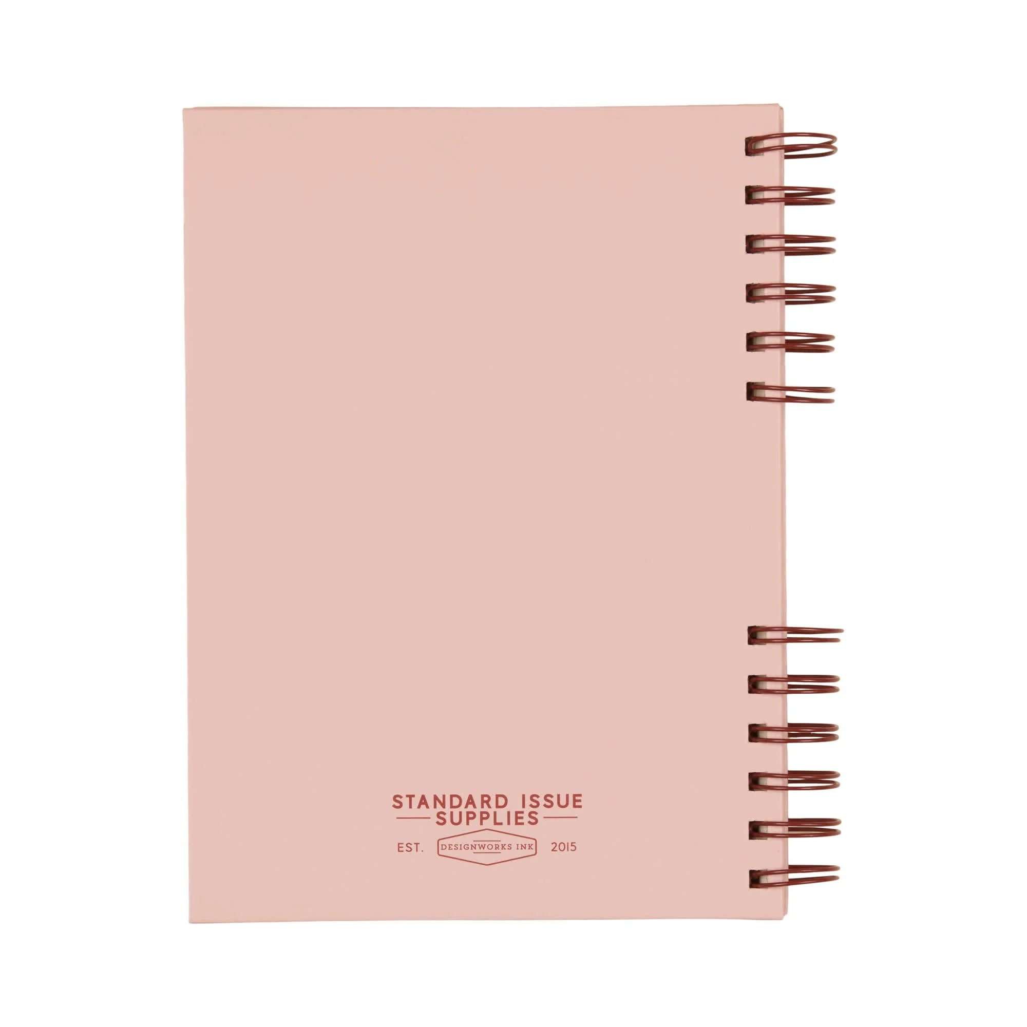 The back of a pink notebook with reed spiral binding on a white background