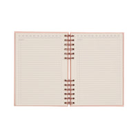 Open pink notebook with red spiral binding and lined pages on a white background