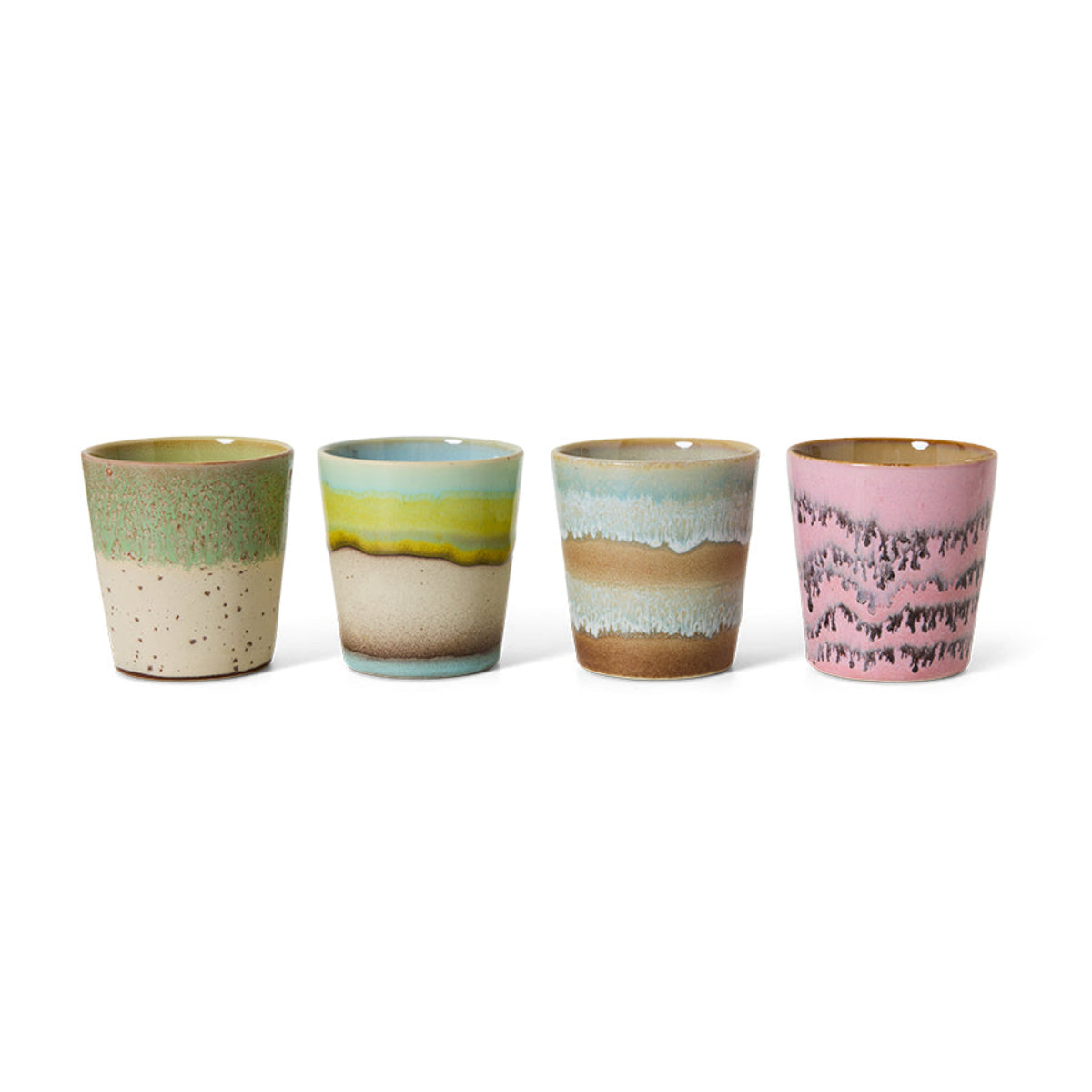 A set of four colourful abstract ceramic coffee mugs on a white background.