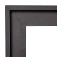 Corner of a black picture frame against a white background