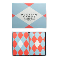 Red and blue playing cards with diagonal pattern below a matching box. 