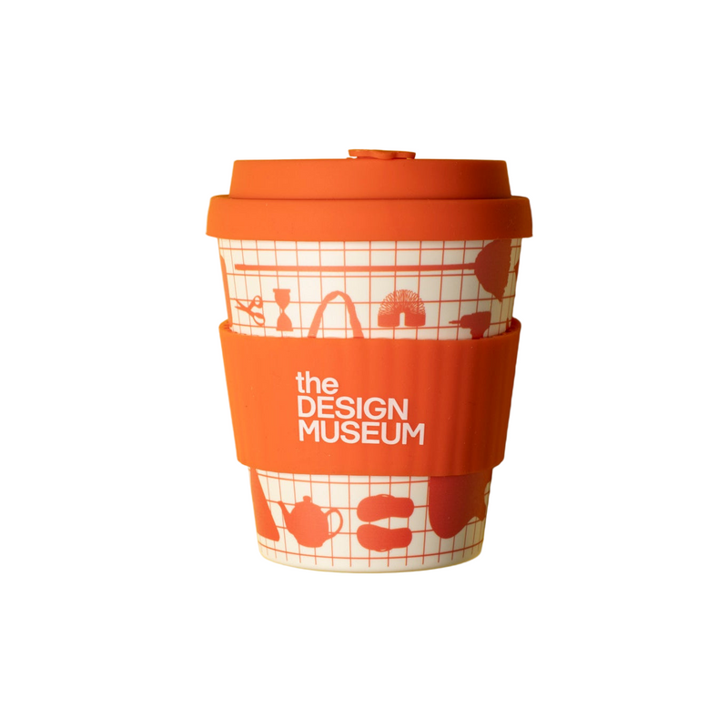 Reusable cup with orange lid and sleeve, featuring design museum branding on a white background