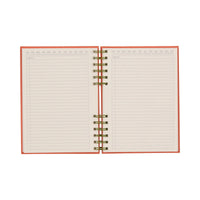 Open red notebook with green spiral binding and lined pages on a white background