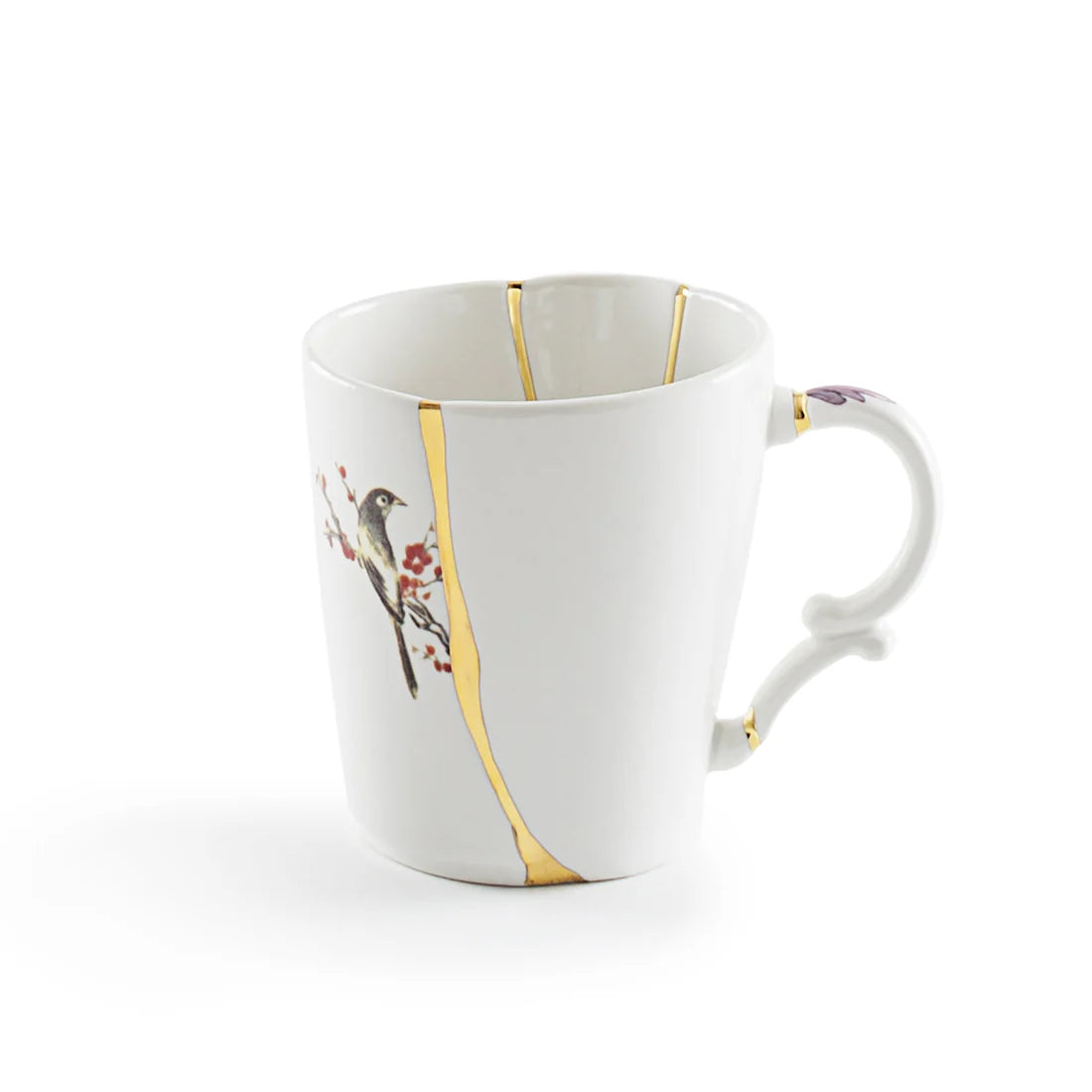 White mug with kintsugi gold accents and bird design on a white background