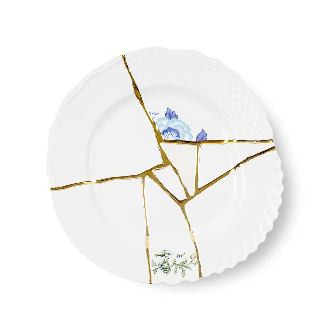 White porcelain plate with gold kintsugi design and floral patterns on a white background